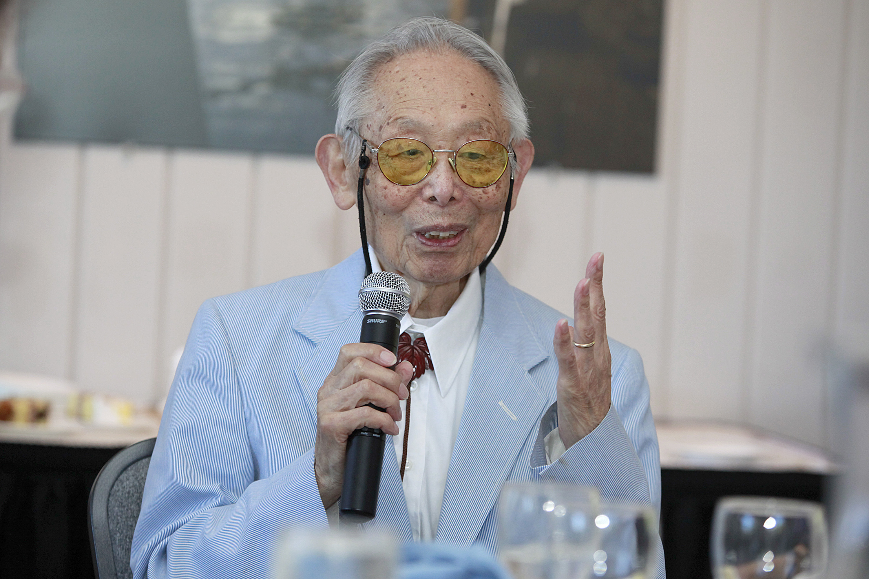 Inoue speaking to group